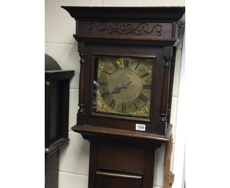 A late 18th century oak longcase clock 30hour going the movement striking on a bell with a brass dial maker Jim Worley Starto