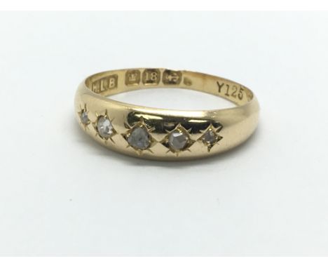 A vintage 18ct gold ring set with five small diamonds, approx 2.7g and approx size N.