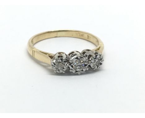 A gold and platinum three stone diamond ring, approx.12ct, approx 2.3g and approx size K.