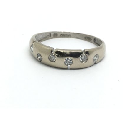 An 18ct white gold six stone diamond ring, approx 1.6g and approx size M.