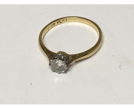 An 18carat gold and platinum ring set with a solitaire diamond approximately 0.40 of a carat ring size N-O