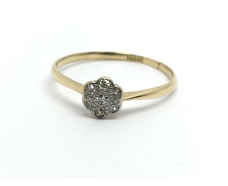 An 18ct gold diamond cluster ring in the form of a flowerhead, approx 1.5g and approx size Q.