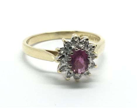 An 18ct gold ruby and diamond cluster ring, approx 3.3g and approx size N.