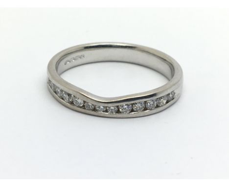 An 18ct white gold half eternity diamond ring, approx 3.7g and approx size O.