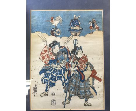 A Japanese woodblock print of travelling musicians possibly By Utagawa Kunisada.