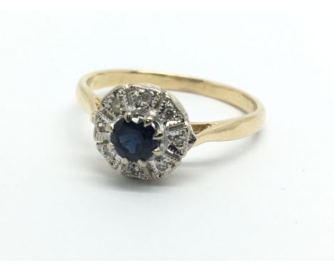 An unmarked gold sapphire and diamond cluster ring, approx 3.2g and approx size Q.