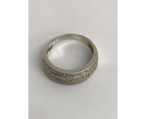 A white gold 14 ct ring inset with three rows of diamond chips.