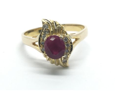 A gold ruby and diamond ring, approx 3.4g and approx size R.