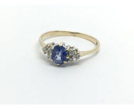 A 9ct gold Ceylon sapphire and diamond ring, approx 1.2g and approx size K-L.