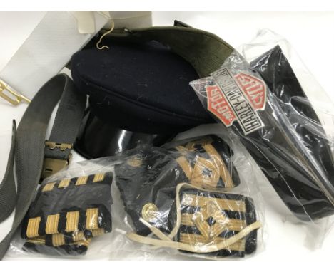 A bag containing costume items including Naval Epaulettes
