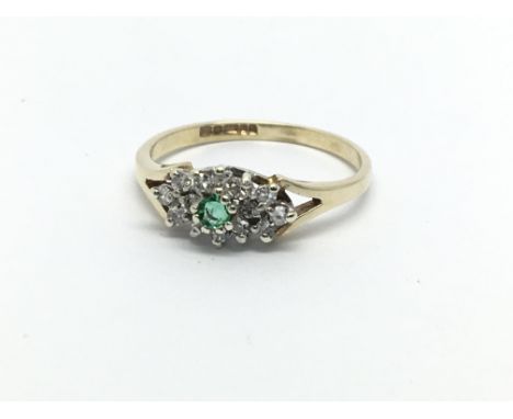 A 9ct gold emerald and diamond cluster ring, approx 1.4g and approx size I.