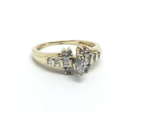 A gold diamond cluster ring set with a central marquis shape diamond, approx 2.4g and approx size J-K.