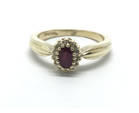 A 9ct yellow gold diamond and ruby cluster ring, approx 2.9g, ring size approx L/M
