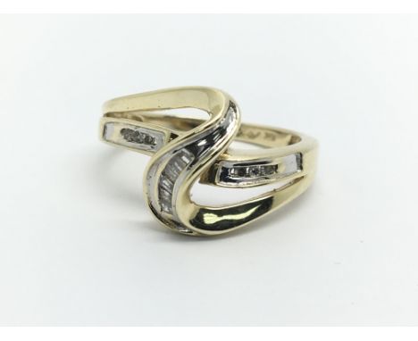 A 10k gold diamond swirl ring, approx 3.1g and approx size N-O.