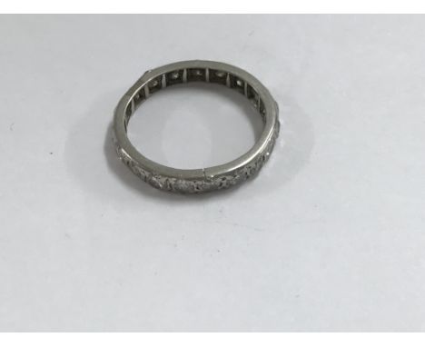 A white gold Eternity ring size N one stone missing.