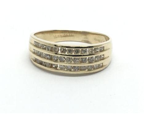 A 14ct gold three row diamond ring, approx 2.9g and approx size M.