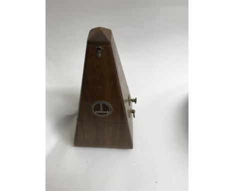 A mahogany case metronome .