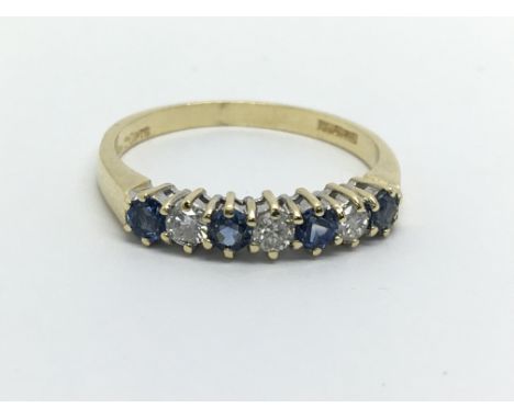 An 18ct gold Ceylon sapphire and diamond half eternity ring, approx 2.5g and approx size N.