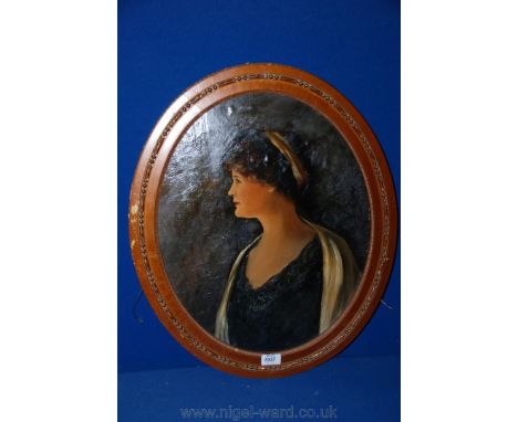 An oval unsigned portrait in oil of a woman