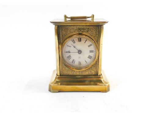 A late 19thC Hamburg American Corporation brass musical carriage clock, white circular dial bearing Roman numerals, the movem