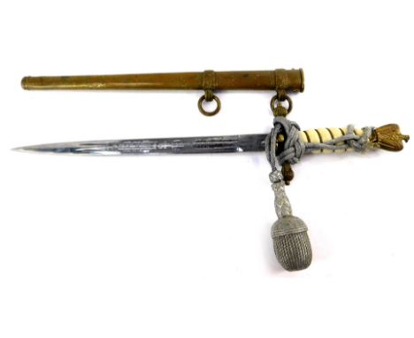 A Third Reich Kriegsmarine dagger, with eagle and swastika pommel, wire bound white grip, cross guard embossed with a furled 