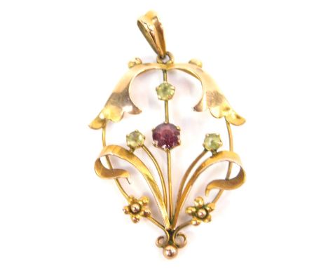 An Art Nouveau 9ct gold amethyst and peridot pendant, of scrolling floral and foliate form, 1.7g.
