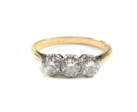 An 18ct gold and diamond three stone ring, approx 0.8cts, size K, 2.2g.