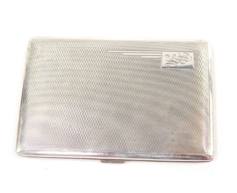 A George VI silver cigarette case, with engine turned decoration, rectangular reserve, monogram engraved, Birmingham 1945, 6.
