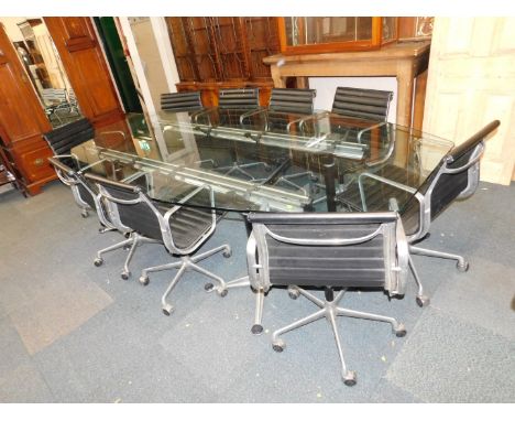 A set of nine ICF Cadsana desk chairs designed by Charles Eames, upholstered in black ribbed leather, and raised on an alumin