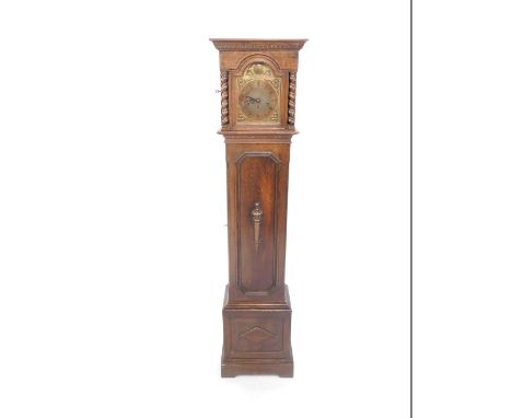 An early 20thC oak cased grandmother clock, brass Tempus Fugit break arch dial with floral spandrels, chapter ring bearing Ro