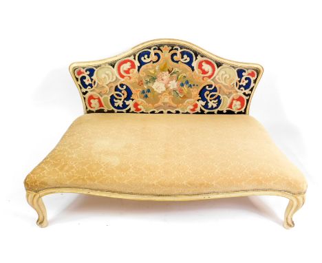 A Victorian cream painted and parcel gilt serpentine day bed, with tapestry back, over stuffed seat, raised on cabriole legs,