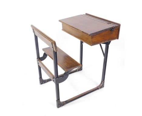 A vintage integral school desk and chair.