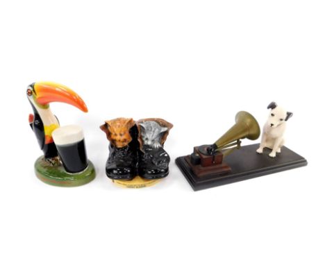 A Carlton ware Guinness Toucan pottery lamp, a Royal Doulton HMV Nipper model with gramophone, and a Royal Doulton Cherry Blo