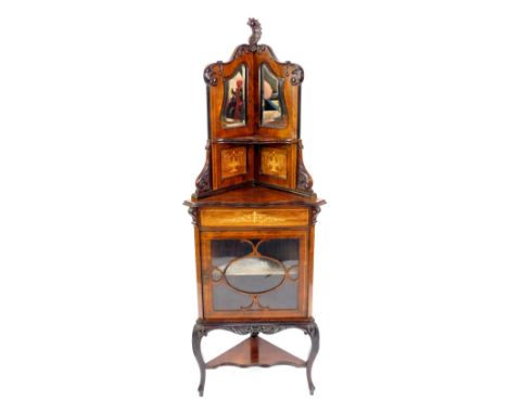 A Victorian rosewood and inlaid corner display cabinet, the top with rococo leaf carving, two shaped bevelled mirrors, and tw