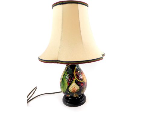 A Moorcroft pottery ovoid lamp decorated in the Queens Choice pattern, with lamp shade, 22cm H.