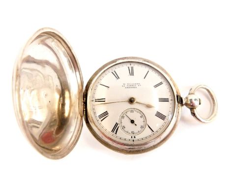 A George V silver full hunter pocket watch, the outer casing of plain design to back, with vacant cartouche to front rubbed, 