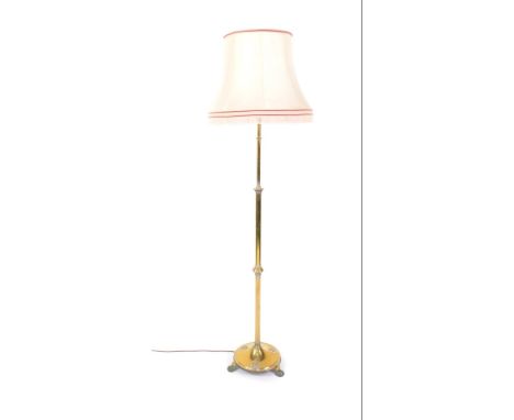 An early 20thC brass standard lamp, converted to electricity, 182cm H.