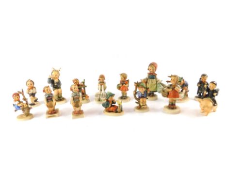 A group of Hummel figures, including Barn Yard Hero, Goose Girl, Apple Tree Girl, Singing Lesson, and Little Helper, together
