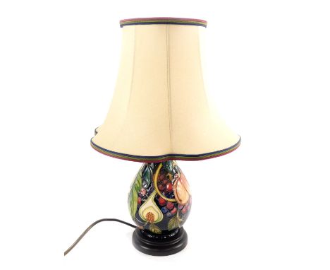 A Moorcroft pottery ovoid lamp decorated in the Queens Choice pattern, with lamp shade, 22cm H.