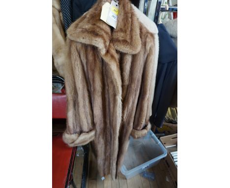 A Ladies 1940s light brown mink fur coat, long length, large cuffs, angular collar, brown lining