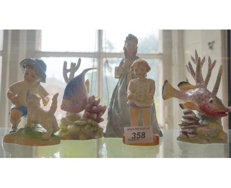 A group of Royal Worcester ceramic items to include a lady figurine 'Sweet Ann', two models of fish to include 'Blue Angel' a