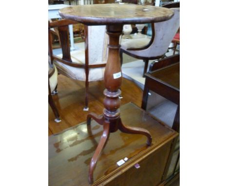 A late Georgian/early Victorian mahogany tripod table of small proportions, with circular top.