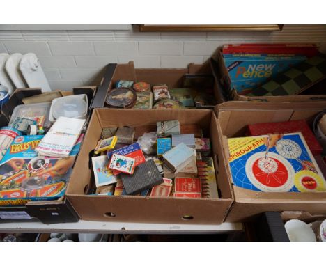 Five boxes of vintage board games, toys and vintage tins to include Lutoma Mild Cocoa, assorted playing cards etc.