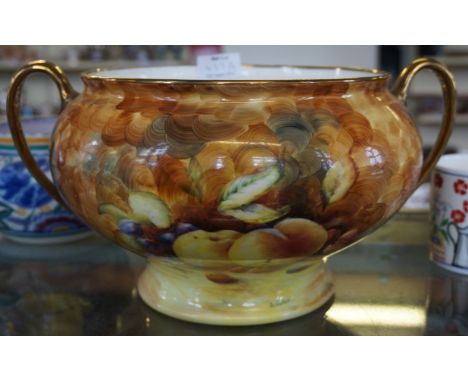 A large ceramic Hose Street Pottery, Tunstall, Stoke on Trent fruit pattern twin handled bowl signed D. Wallace.
