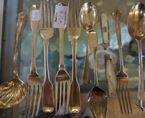 A mixed group of hallmarked silver items to include a London hallmarked silver ladle with fluted decoration, two mother of pe