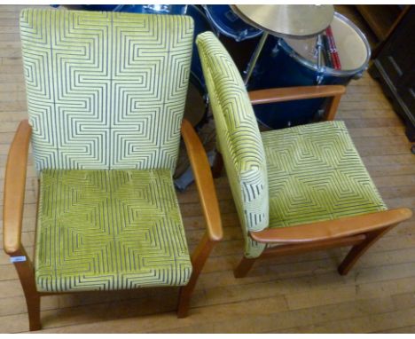 A contemporary light beech framed open sided armchair, upholstered in a lime green geometric material.