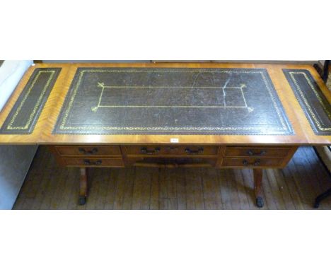 A good quality reproduction mahogany veneered drop leaf sofa table, having five assorted drawers, raised lyre supports.