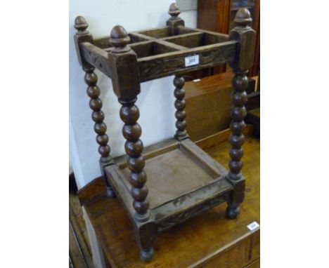 An early 20th Century Jacobean revival four division stick stand.