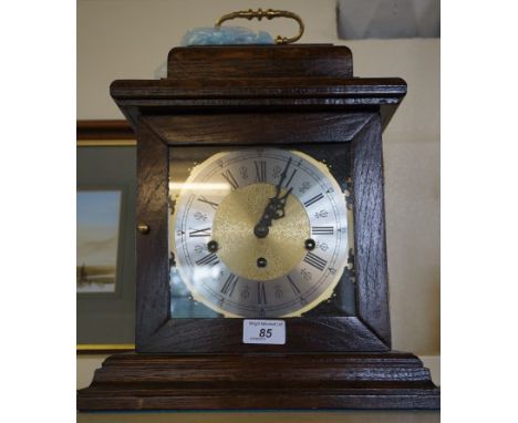 An early to mid 20th Century oak cased mantel clock.