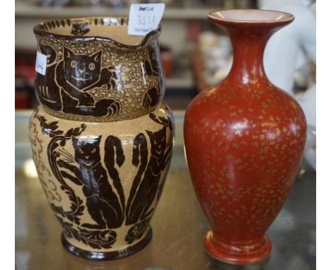 A Royal Doulton vase of baluster form decorated upon an iron red ground with gilt floral decoration, together with further Ro